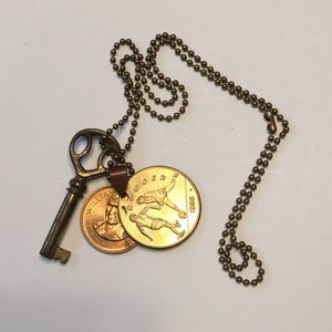 Vintage brass key coin necklace